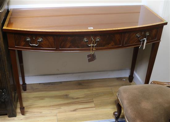 A George III style bowfront serving table W.122cm.